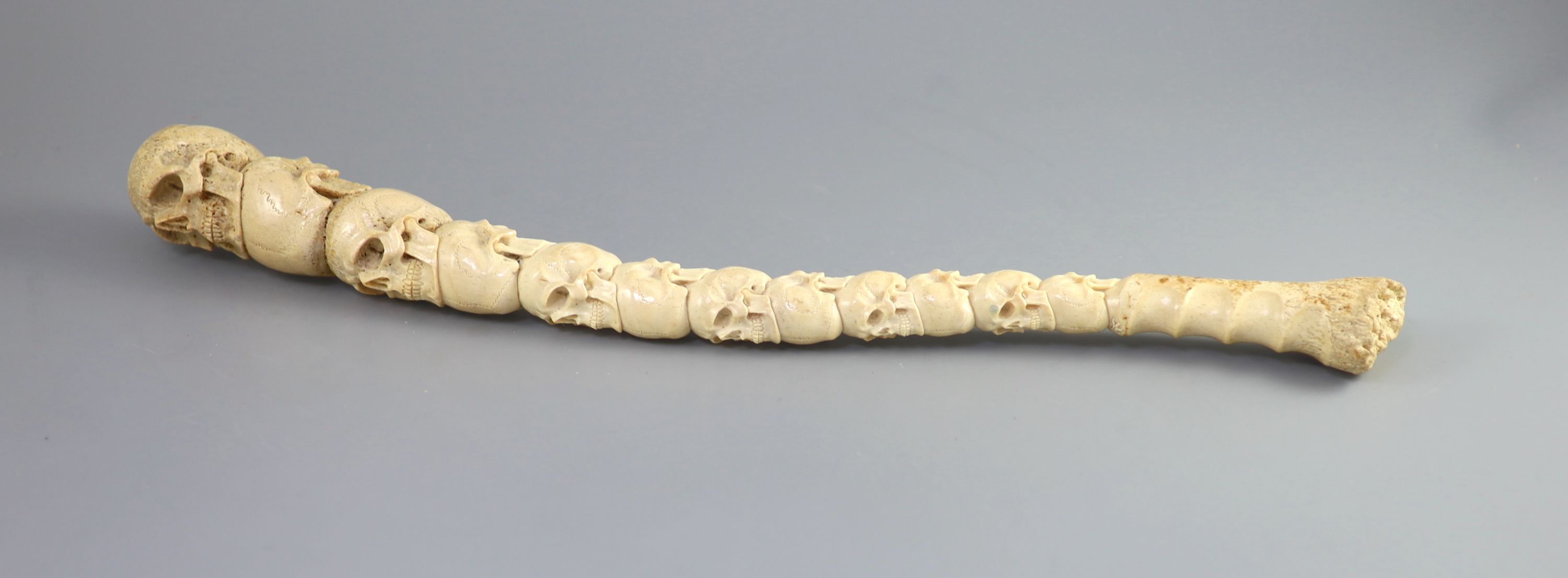 A unusual Inuit ‘skull’ carved walrus baculum, believed to be 19th century, 49.5 cm long